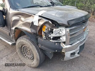 2013 Chevrolet Silverado 1500 LT with VIN 1GCRKSE70DZ202177, listed as a IAAI auction lot 41515775 with 189,671 mi miles and . Bid and sale history available at DreamBid. Image 17.