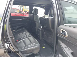 2014 Jeep Grand Cherokee Overland with VIN 1C4RJFCM8EC486259, listed as a IAAI auction lot 42105296 with 129,342 mi miles. Bid and sale history available at carsss.com. Image 8.
