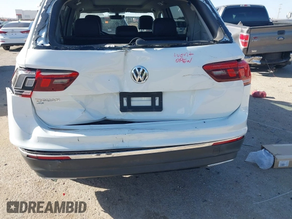 2021 Volkswagen Tiguan SE with VIN 3VV3B7AX9MM051920, listed as a IAAI auction lot 41826721 with 127,699 mi miles and . Bid and sale history available at DreamBid. Image 6.