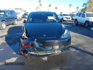 2023 Tesla Model Y Performance with VIN 7SAYGDEF6PF854797, listed as a IAAI auction lot 41319332 with 46,132 mi miles and . Bid and sale history available at DreamBid. Image 6.