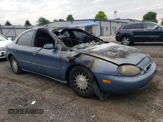 1999 Mercury Sable LS z VIN 1MEFM53S4XG649132, wystawiony jako Copart lot #70168934 z przebiegiem Nie podano mil oraz Nie do naprawy. Historia ofert i sprzedaży dostępna na DreamBid. Obrazek 4.