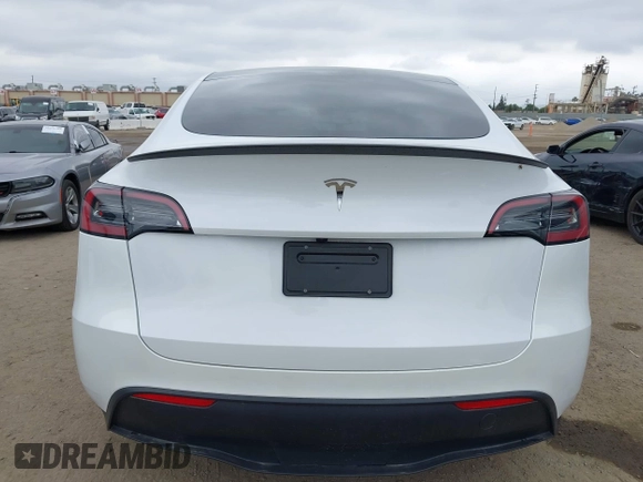 2024 Tesla Model Y with VIN 7SAYGDED4RF055859, listed as a IAAI auction lot 42201099 with 17,373 mi miles and . Bid and sale history available at DreamBid. Image 16.