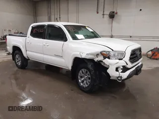 2019 Toyota Tacoma SR z VIN 3TMCZ5AN2KM189373, wystawiony jako IAAI lot #41834265 z przebiegiem 75 908 mil mil oraz . Historia ofert i sprzedaży dostępna na DreamBid. Obrazek 1.
