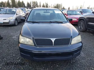 2003 Mitsubishi Lancer ES with VIN JA3AJ26E83U006060, listed as a IAAI auction lot 41254660 with 220,490 mi miles. Bid and sale history available at carsss.com. Image 12.