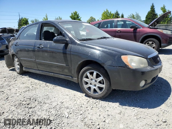 2005 Kia Spectra LX with VIN KNAFE121255156796, listed as a Copart auction lot 58595684 with 197,792 mi miles and Salvage Title. Bid and sale history available at carsss.com. Image 4.