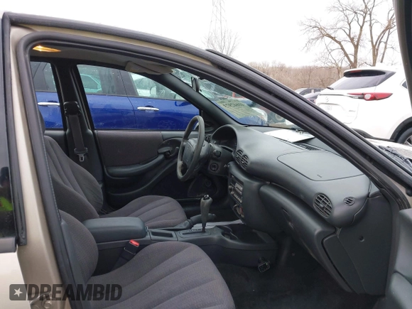 2002 Pontiac Sunfire SE z VIN 1G2JB524927104822, wystawiony jako IAAI lot #41642973 z przebiegiem 120 321 mil mil oraz . Historia ofert i sprzedaży dostępna na DreamBid. Obrazek 5.