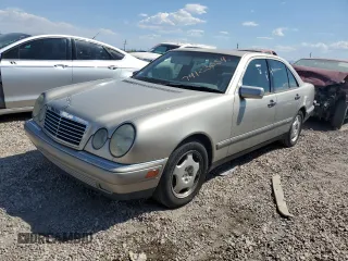 1997 Mercedes-Benz E-Class with VIN WDBJF72F2VA274233, listed as a Copart auction lot 74123554 with 80,914 mi miles and Salvage Title. Bid and sale history available at carsss.com. Image 1.