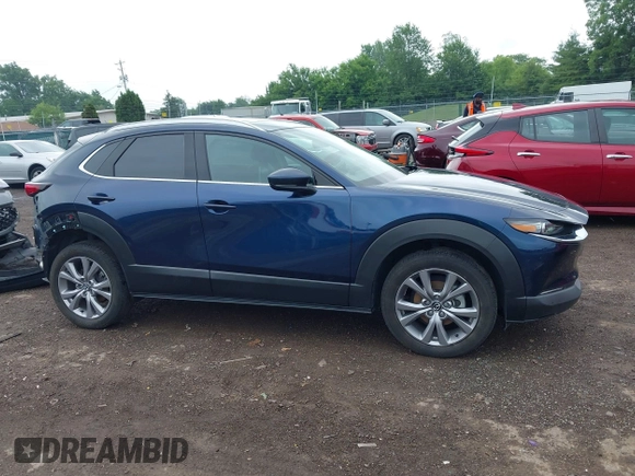 2022 Mazda CX-30 S Premium with VIN 3MVDMBDL0NM413545, listed as a IAAI auction lot 42493594 with 57,013 mi miles and . Bid and sale history available at DreamBid. Image 14.