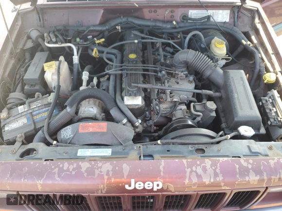 2000 Jeep Cherokee z VIN 1J4FF48S2YL135037, wystawiony jako Copart lot #66156505 z przebiegiem 72 433 mil mil oraz Szkoda całkowita • Salvage title. Historia ofert i sprzedaży dostępna na DreamBid. Obrazek 11.