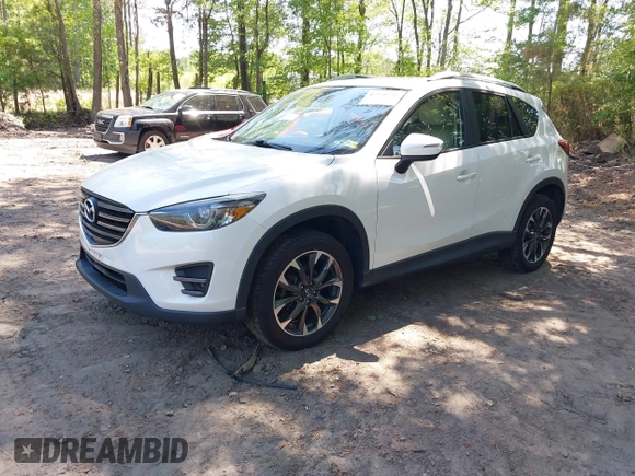 2016 Mazda CX-5 Grand Touring with VIN JM3KE2DY0G0870077, listed as a IAAI auction lot 42158225 with 93,816 mi miles. Bid and sale history available at carsss.com. Image 17.