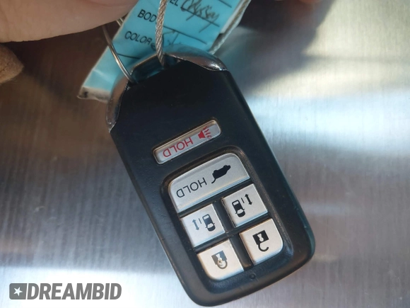 2014 Honda Odyssey Touring with VIN 5FNRL5H97EB094353, listed as a IAAI auction lot 41701712 with 141,228 mi miles and . Bid and sale history available at DreamBid. Image 11.