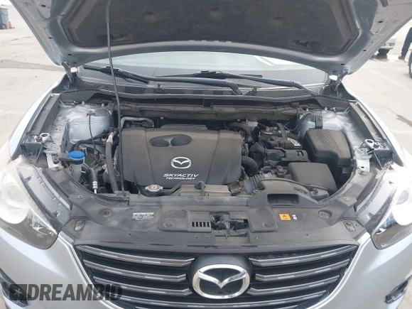 2016 Mazda CX-5 Grand Touring with VIN JM3KE2DY9G0723921, listed as a IAAI auction lot 41681522 with 83,893 mi miles. Bid and sale history available at carsss.com. Image 10.