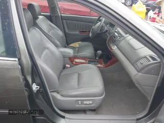 2005 Toyota Camry LE with VIN 4T1BF32K25U595176, listed as a IAAI auction lot 41932171 with 203,956 mi miles and . Bid and sale history available at DreamBid. Image 5.