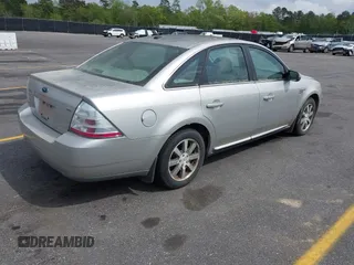 2008 Ford Taurus SEL with VIN 1FAHP24W88G178210, listed as a IAAI auction lot 41933552 with 142,971 mi miles. Bid and sale history available at carsss.com. Image 4.