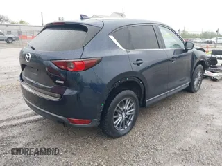 2017 Mazda CX-5 Touring z VIN JM3KFBCL4H0156571, wystawiony jako IAAI lot #42183562 z przebiegiem 135 595 mil mil oraz . Historia ofert i sprzedaży dostępna na DreamBid. Obrazek 4.