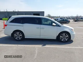 2016 Honda Odyssey Touring Elite with VIN 5FNRL5H97GB044278, listed as a IAAI auction lot 42056101 with 182,396 mi miles and . Bid and sale history available at DreamBid. Image 13.