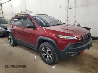 2015 Jeep Cherokee Trailhawk z VIN 1C4PJMBS9FW509642, wystawiony jako Copart lot #52385555 z przebiegiem 135 477 mil mil oraz Szkoda całkowita • Salvage title. Historia ofert i sprzedaży dostępna na DreamBid. Obrazek 4.