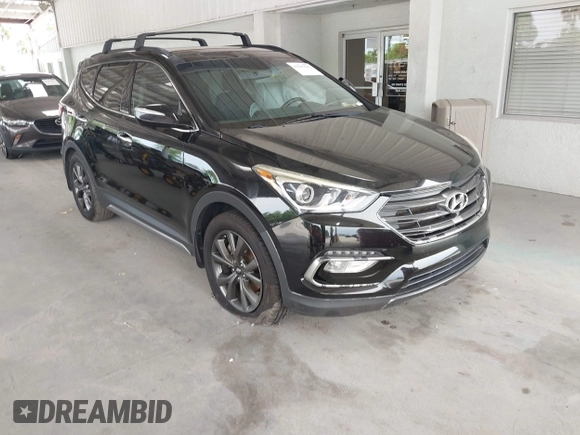 2018 Hyundai Santa Fe Ultimate z VIN 5NMZW4LA6JH054308, wystawiony jako IAAI lot #42385503 z przebiegiem 108 004 mil mil oraz . Historia ofert i sprzedaży dostępna na DreamBid. Obrazek 1.