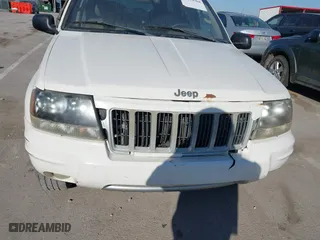 2004 Jeep Grand Cherokee Laredo with VIN 1J4GX48S84C206933, listed as a IAAI auction lot 41739364 with 257,893 mi miles. Bid and sale history available at carsss.com. Image 6.