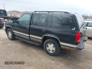 1998 GMC Yukon with VIN 1GKEK13R9WJ734112, listed as a IAAI auction lot 42072548 with 226,061 mi miles. Bid and sale history available at carsss.com. Image 3.