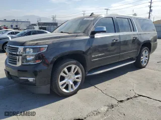 2017 Chevrolet Suburban Premier with VIN 1GNSCJKC0HR140111, listed as a Copart auction lot 74387664 with 104,094 mi miles and Salvage Title. Bid and sale history available at carsss.com. Image 1.