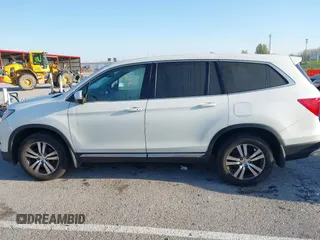 2017 Honda Pilot EX-L with VIN 5FNYF6H54HB015814, listed as a IAAI auction lot 41955743 with 122,389 mi miles and . Bid and sale history available at DreamBid. Image 14.