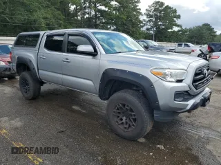2016 Toyota Tacoma SR5 with VIN 5TFAX5GN3GX073301, listed as a Copart auction lot 71953054 with 148,396 mi miles and Salvage Title. Bid and sale history available at carsss.com. Image 4.