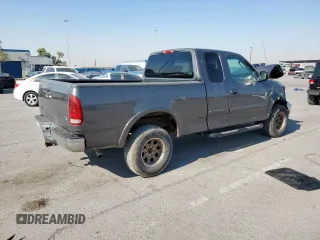 2002 Ford F-150 XL with VIN 1FTPX18L32NB65156, listed as a Copart auction lot 61418955 with 176,622 mi miles and Salvage title. Bid and sale history available at DreamBid. Image 3.