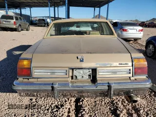 1985 Oldsmobile 88 z VIN 1G3BY69Y7F9098039, wystawiony jako Copart lot #87831785 z przebiegiem 72 684 mil mil oraz Szkody całkowita. Historia ofert i sprzedaży dostępna na DreamBid. Obrazek 6.