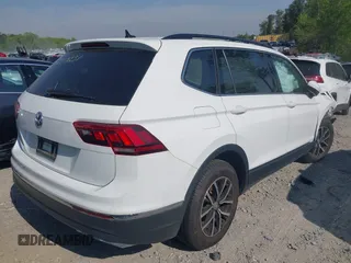 2021 Volkswagen Tiguan SE with VIN 3VV3B7AX7MM080266, listed as a IAAI auction lot 42062147 with 66,786 mi miles and . Bid and sale history available at DreamBid. Image 4.