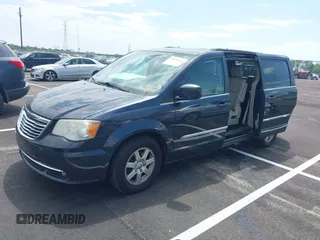 2013 Chrysler Town & Country Touring with VIN 2C4RC1BG8DR594671, listed as a IAAI auction lot 42039026 with 208,909 mi miles. Bid and sale history available at carsss.com. Image 2.