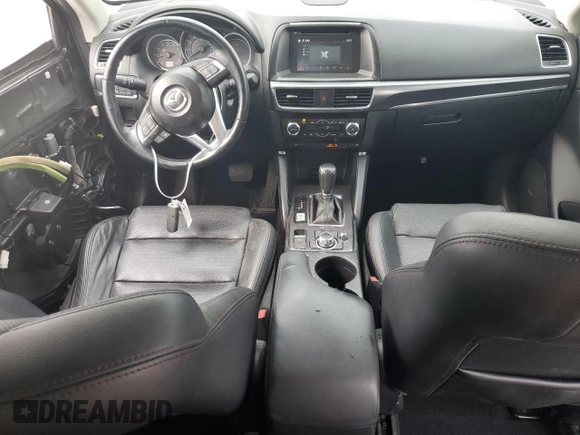 2016 Mazda CX-5 Grand Touring z VIN JM3KE2DY5G0676290, wystawiony jako Copart lot #54155325 z przebiegiem 124 743 mil mil oraz Szkoda całkowita • Salvage title. Historia ofert i sprzedaży dostępna na DreamBid. Obrazek 8.