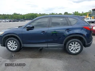 2016 Mazda CX-5 Sport with VIN JM3KE2BY0G0850298, listed as a IAAI auction lot 42107007 with 97,478 mi miles. Bid and sale history available at carsss.com. Image 14.