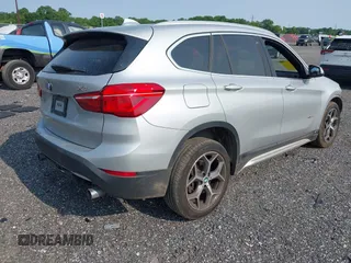 2018 BMW X1 xDrive28i with VIN WBXHT3C32J5K23486, listed as a IAAI auction lot 42387208 with 76,115 mi miles and . Bid and sale history available at DreamBid. Image 4.