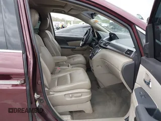 2014 Honda Odyssey Touring with VIN 5FNRL5H94EB127695, listed as a IAAI auction lot 41936109 with 221,786 mi miles and . Bid and sale history available at DreamBid. Image 5.