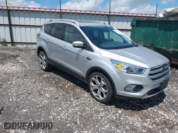2017 Ford Escape Titanium with VIN 1FMCU0J99HUB23567, listed as a IAAI auction lot 42127795 with 93,056 mi miles. Bid and sale history available at carsss.com. Image 1.