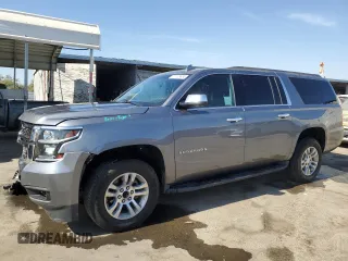 2019 Chevrolet Suburban LS z VIN 1GNSCGKC6KR209877, wystawiony jako Copart lot #77125534 z przebiegiem 67 591 mil mil oraz Szkoda całkowita • Salvage title. Historia ofert i sprzedaży dostępna na DreamBid. Obrazek 1.