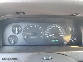 1999 Jeep Grand Cherokee Laredo with VIN 1J4GW58N4XC739465, listed as a Copart auction lot 76130544 with 195,649 mi miles and Salvage Title. Bid and sale history available at carsss.com. Image 9.