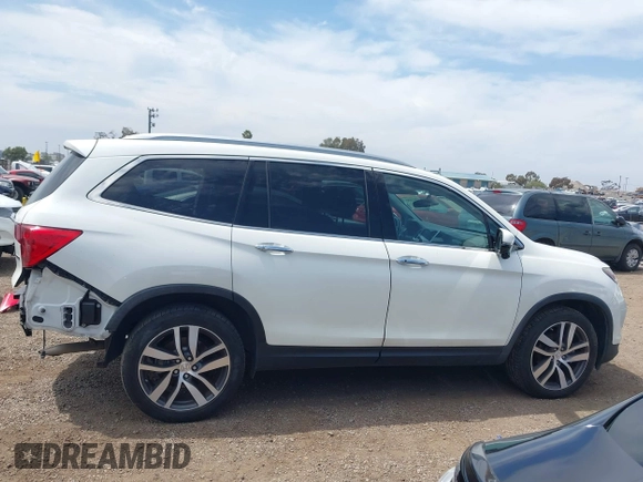 2017 Honda Pilot Touring with VIN 5FNYF5H95HB042632, listed as a IAAI auction lot 42011885 with 103,321 mi miles. Bid and sale history available at carsss.com. Image 14.