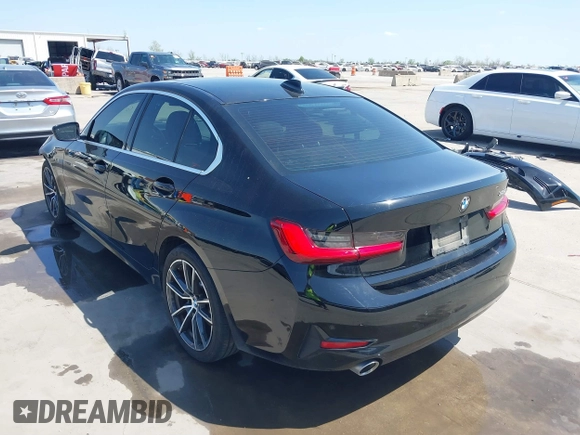 2019 BMW 3 Series 330i with VIN WBA5R1C51KFH09402, listed as a IAAI auction lot 41869138 with 59,115 mi miles and . Bid and sale history available at DreamBid. Image 3.