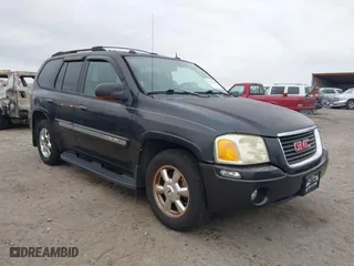 2004 GMC Envoy SLE with VIN 1GKDT13S642431159, listed as a IAAI auction lot 41511508 with 132,653 mi miles. Bid and sale history available at carsss.com. Image 1.