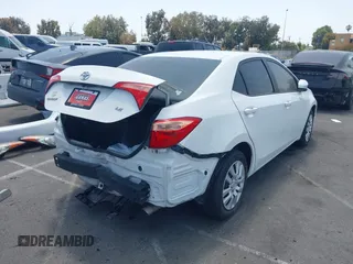 2018 Toyota Corolla L with VIN 5YFBURHE7JP810444, listed as a IAAI auction lot 42558647 with 74,794 mi miles and . Bid and sale history available at DreamBid. Image 4.