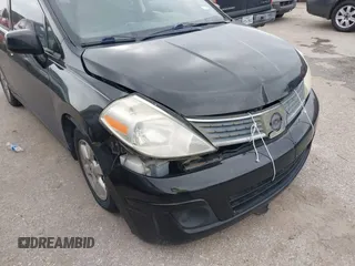 2009 Nissan Versa 1.8 SL with VIN 3N1BC13E59L496882, listed as a IAAI auction lot 41798734 with 210,907 mi miles. Bid and sale history available at carsss.com. Image 13.