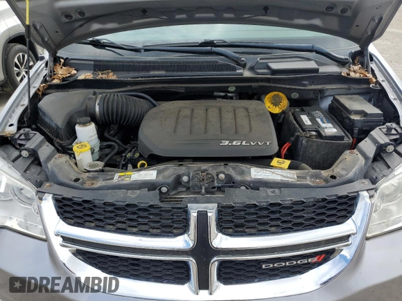 2015 Dodge Grand Caravan American Value with VIN 2C4RDGBG3FR507956, listed as a Copart auction lot 55948415 with 88,534 mi miles and Salvage Title. Bid and sale history available at DreamBid. Image 12.