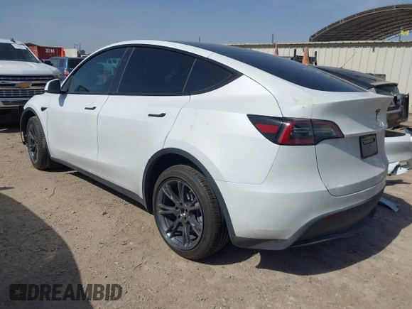 2024 Tesla Model Y with VIN 7SAYGDEDXRA300743, listed as a IAAI auction lot 41690374 with 12,446 mi miles and . Bid and sale history available at DreamBid. Image 3.