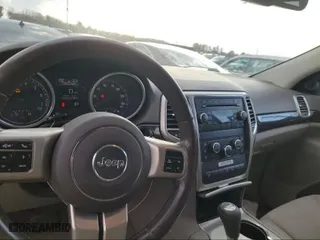 2011 Jeep Grand Cherokee Laredo with VIN 1J4RR4GG1BC669834, listed as a IAAI auction lot 42019804 with 173,943 mi miles. Bid and sale history available at carsss.com. Image 10.