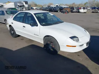 1999 Pontiac Sunfire SE z VIN 1G2JB5249X7553733, wystawiony jako IAAI lot #41980554 z przebiegiem 153 212 mil mil oraz . Historia ofert i sprzedaży dostępna na DreamBid. Obrazek 1.
