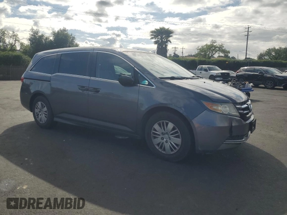 2015 Honda Odyssey LX with VIN 5FNRL5H27FB018491, listed as a Copart auction lot 54888445 with 129,488 mi miles and Salvage Title. Bid and sale history available at DreamBid. Image 4.