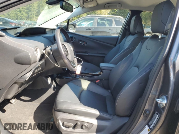2021 Toyota Prius LE with VIN JTDKAMFP7M3185847, listed as a Copart auction lot 52897465 with 58,996 mi miles and Salvage Title. Bid and sale history available at DreamBid. Image 7.