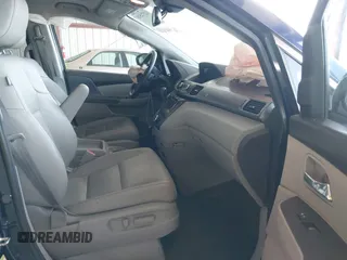 2017 Honda Odyssey Touring with VIN 5FNRL5H90HB017215, listed as a IAAI auction lot 42574528 with 61,386 mi miles and . Bid and sale history available at DreamBid. Image 5.